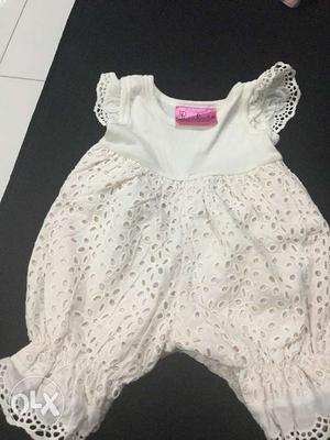 White cut work romper Wil fit a baby of 6-9