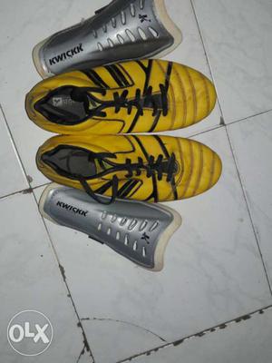 Yellow-and-black Athletic Shoes And Gray Shinguards
