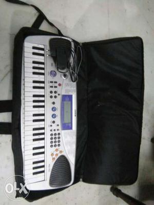 A casio MA 150 with a black cover/bag and with a