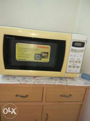 Beige And White Microwave Oven.National make
