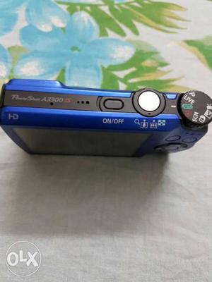 Blue Canon digital camera 16 mega pixel sparingly used with