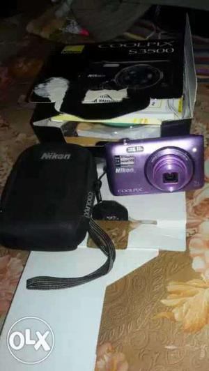 Purple Nikon Coolpix Camera with case in new condition
