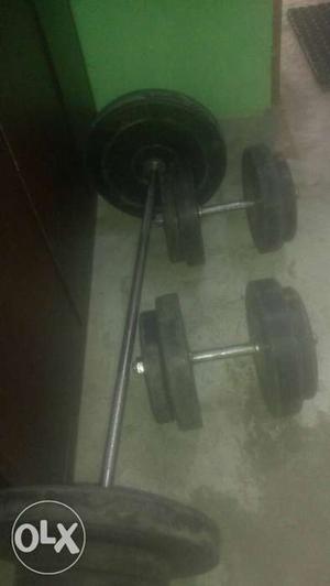 Three Black-and-silver Dumbbells And Barbell