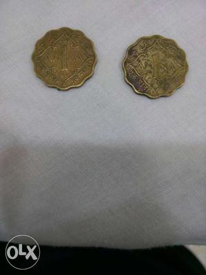 Two 1 Anna british india coins.