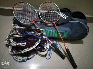 Two Red And Silver Yonex Badminton Rackets