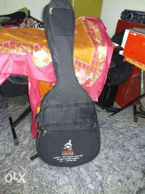1 year old GBAndA acoustic guiter with bag in a