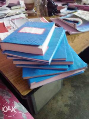 Four Blue Hardbound Books