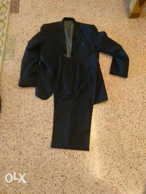 Custom made black suit with pleated pants and a