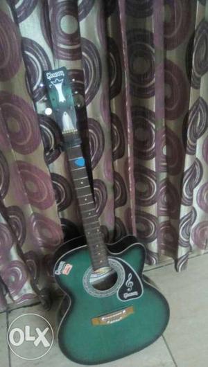 Free capo and pic good condition givson guitar