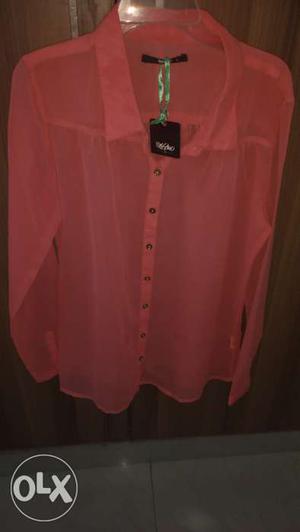 Peach coloured unused new ladies shirt.. looks great