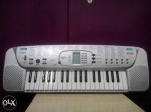 Silver And White Casio Electric Piano with digital display