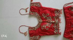 Unused red hand embroidered rich lehenga