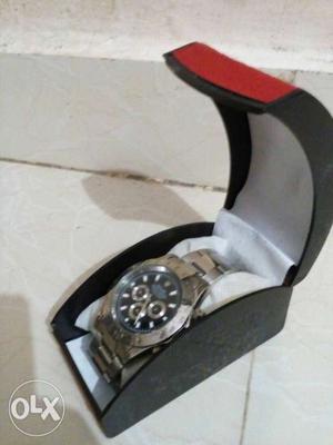 Black Face Round Frame Chronograph Watch In Case