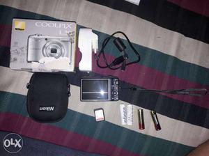 Black Nikon Coolpix L30 Camera With Four Batteries With