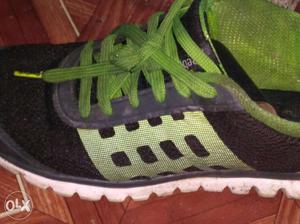 Black-green-and-white Reebok Sneaker