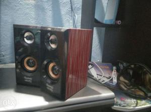 Pair Of Brown And Red Speakers