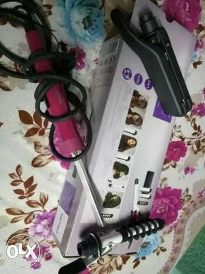 Red, Silver, And Black Hair Curler On Box