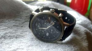 Round Gold And Black Chronograph Watch
