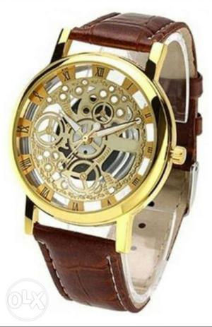 Round Gold Mechanical Watch With Brown Leather Strap