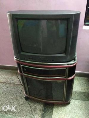 Sansui colour TV with trolly & good, working condition.