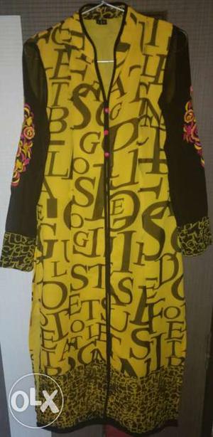 Yellow long alphabet kurti with embroidery on