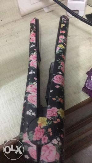 Black And Pink Floral Hair Iron company sutra and brought it