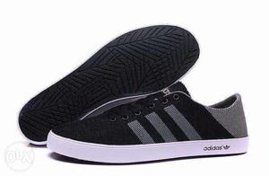 Black-and-grey Adidas Low Tops