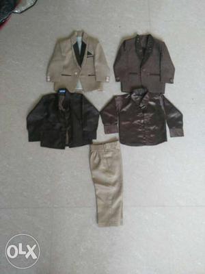 Four Boy's Grey And Black Suit Jackets And Dress Pants