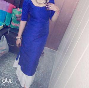 Full dress blue long kurti wid white skirt..