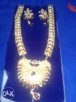 Gold And Red Kundan Necklace And Earrings