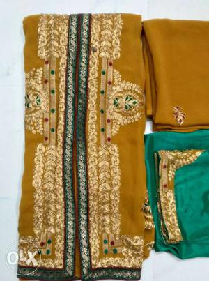 Golden and sea green sherwani suit