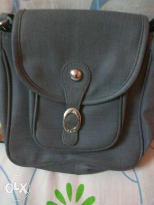 Grey sling bag