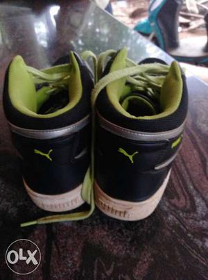 Pair Of Black-and-green Puma High Top Sneakers