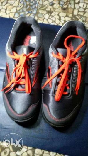 Pair Of Black-and-orange Sneakers