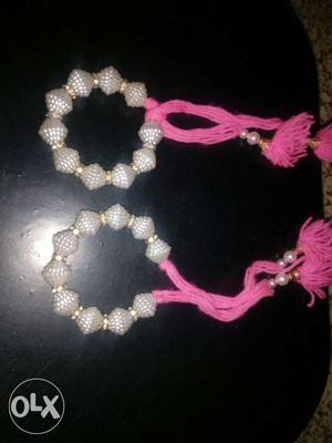 Pair Of Pink-and-silver Bracelets