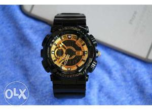Round Black And Brown G-Shock Digital Watch With Black Strap