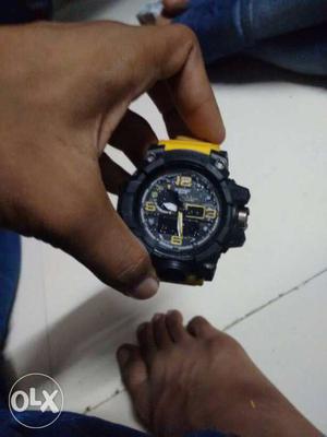 Round Black Chronograph Watch With Yellow Rubber Strap