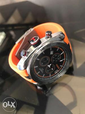 Round Face Silver Link Tissot Chronograph Watch With Orange