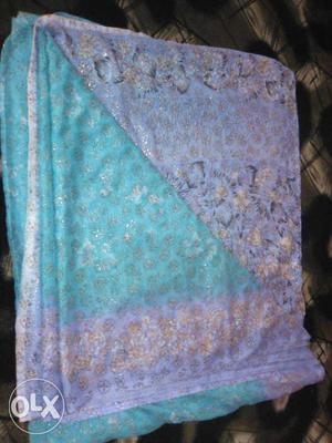 Teal And Purple Floral Textile