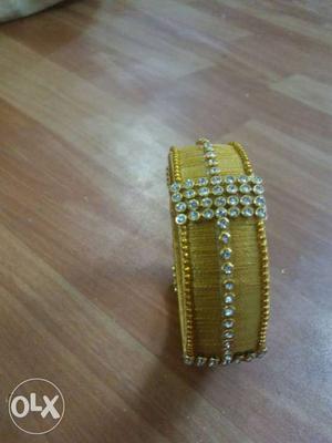 Yellow And Silver Embedded Jhumkas Bangle