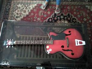 4 months old... Red-black guitar.. Good condition