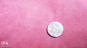 Ancient antique coin from the Mughal era. Atleast