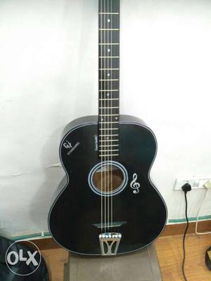 Black color pure acoustic guitar, hollow body,