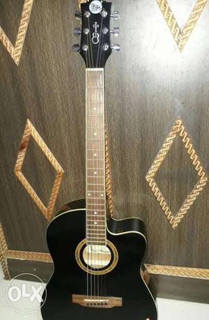 Black guitar for sell with cover and extra pair