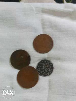 Four Brown And Black Asian Coins