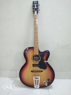 Givson Brown Acoustic Guitar with electronic o/p