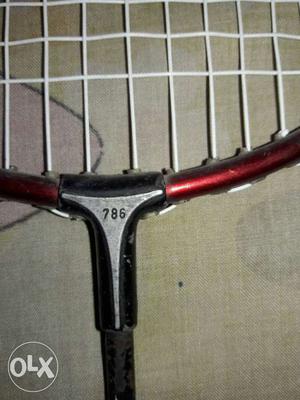 Silver's badminton racquet numbered 786. Also on