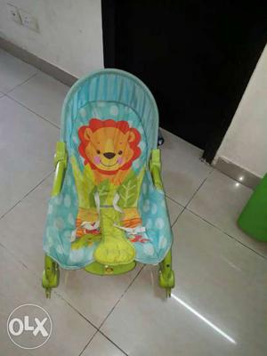 Baby's Green And Teal Lion Print Bouncer
