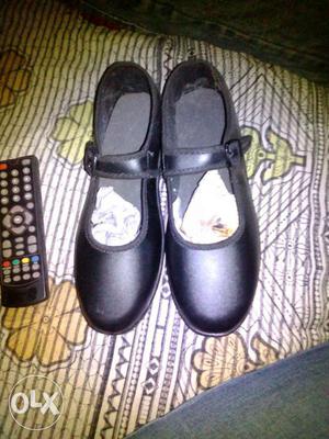 Black Leather Mary Jane Shoes And Black Remote Control