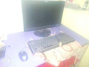 Flat Screen Computer Monitor And Black Computer Keyboard